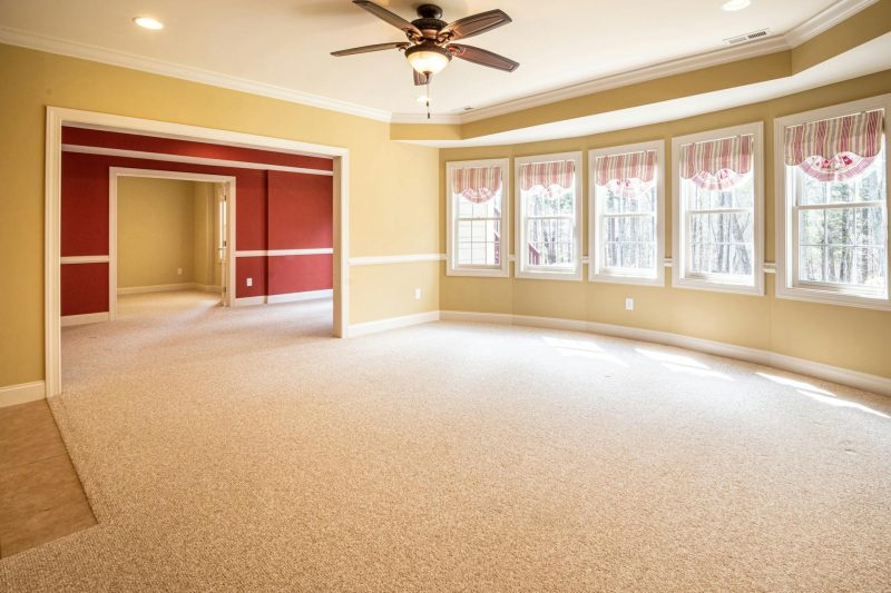 Home 12 Bright empty room with carpet and ceiling fan ideal for resi 1774976520