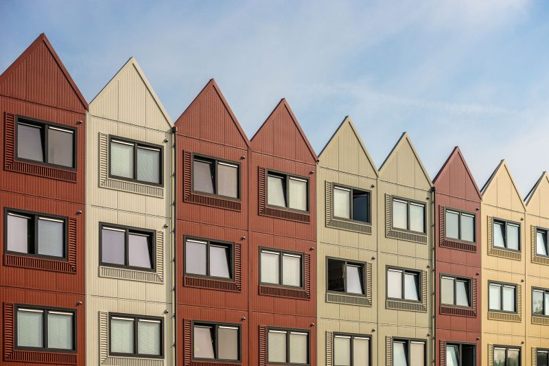 Home 24 A vibrant row of gableroofed residential buildings with meta 1782838821