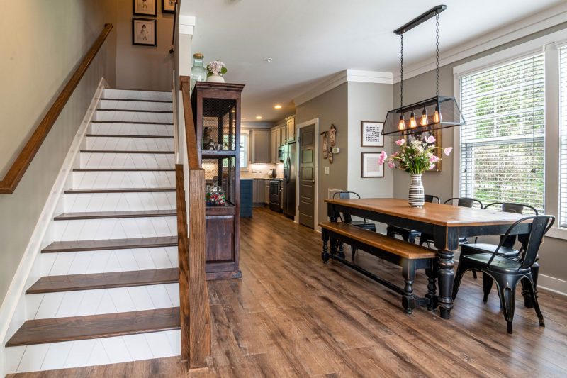 Home 22 Bright and inviting dining area features a wooden table stai 1784048529