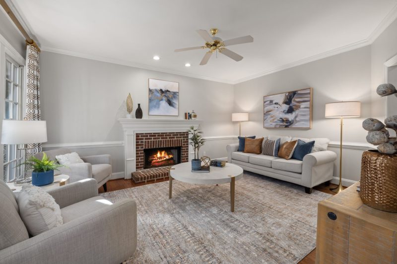 Home 20 A cozy modern living room featuring a fireplace elegant sofa 1788282050